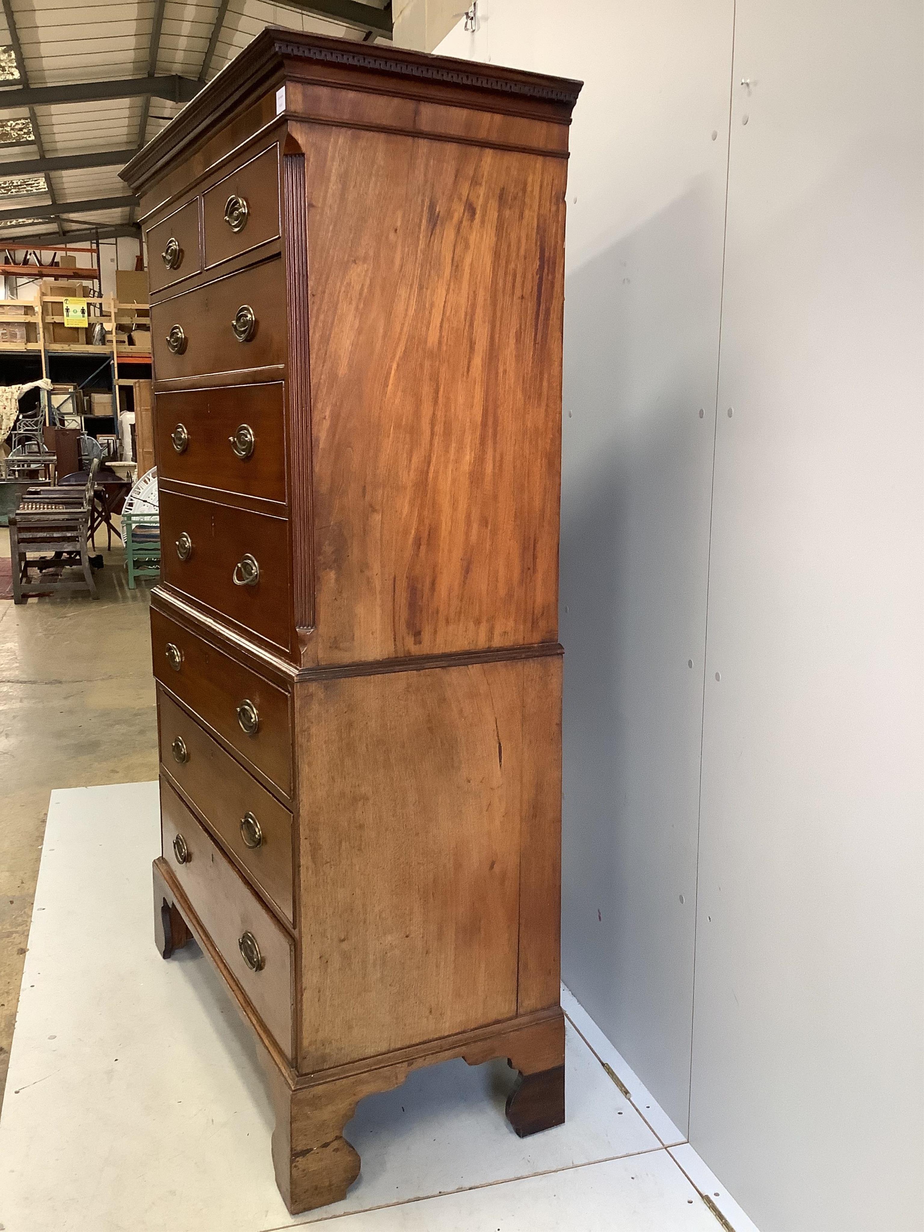 A George III inlaid mahogany chest on chest, width 106cm, depth 50cm, height 185cm. Condition - fair